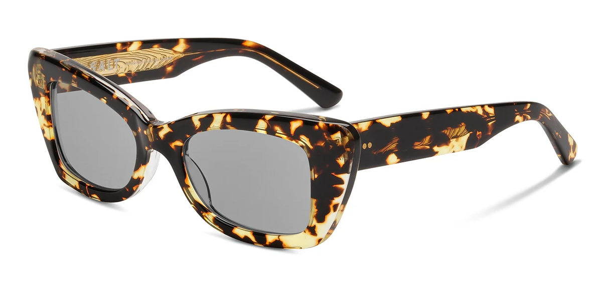 SALT. Tory sunglasses by SALT., featuring a tortoiseshell-patterned Japanese acetate frame with thick rectangular sides and gray polarized optical lenses, are displayed at a slight angle against a white background.