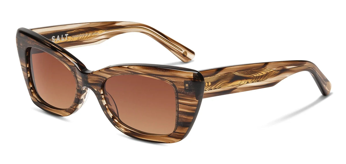The SALT. Tory sunglasses by SALT. are shown on a white background, featuring brown marbled cat-eye frames crafted from premium Japanese acetate with thick rims and gradient brown lenses; the inside of the left arm is labeled SALT.