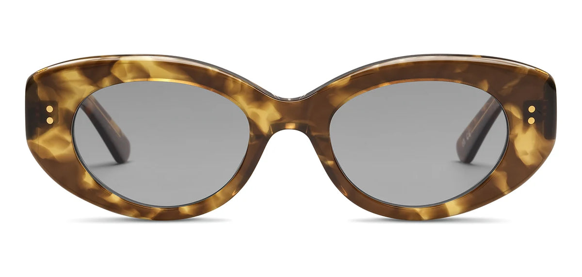 SALT. Cass by SALT.: Oval sunglasses with thick brown tortoiseshell frames, crafted from premium Japanese acetate, featuring gray lenses with anti-reflective coatings, shown from the front against a white background.