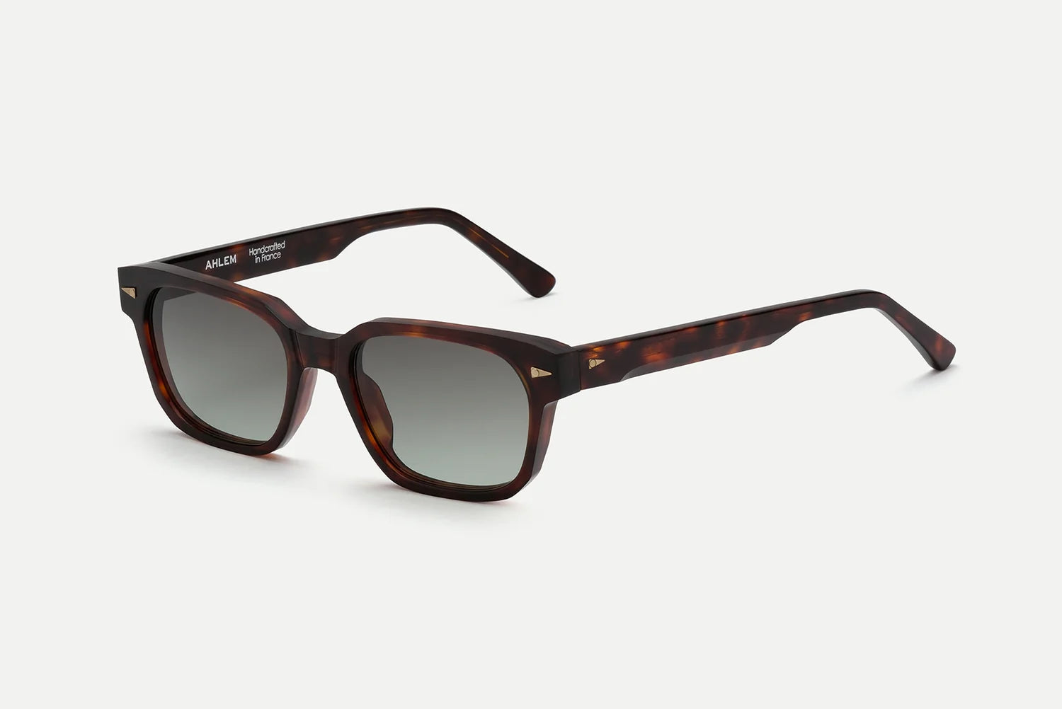 AHLEM Sedaine square sunglasses in tortoiseshell, shown with gradient dark lenses on a white background. These luxury French frames by AHLEM are handcrafted from acetate, featuring white text near the hinge on the left arm.