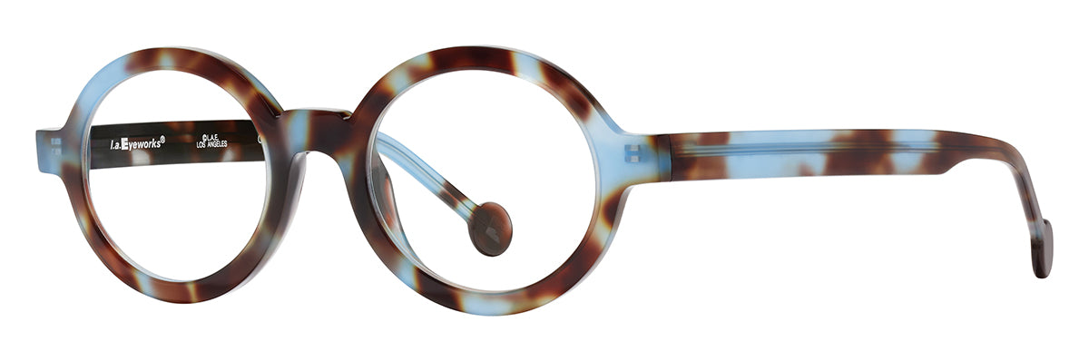 Round optical glasses in mottled brown tortoise and translucent blue acetate with clear lenses, thick rounded rims, and matching patterned temples shown at an angled side view on a white background.