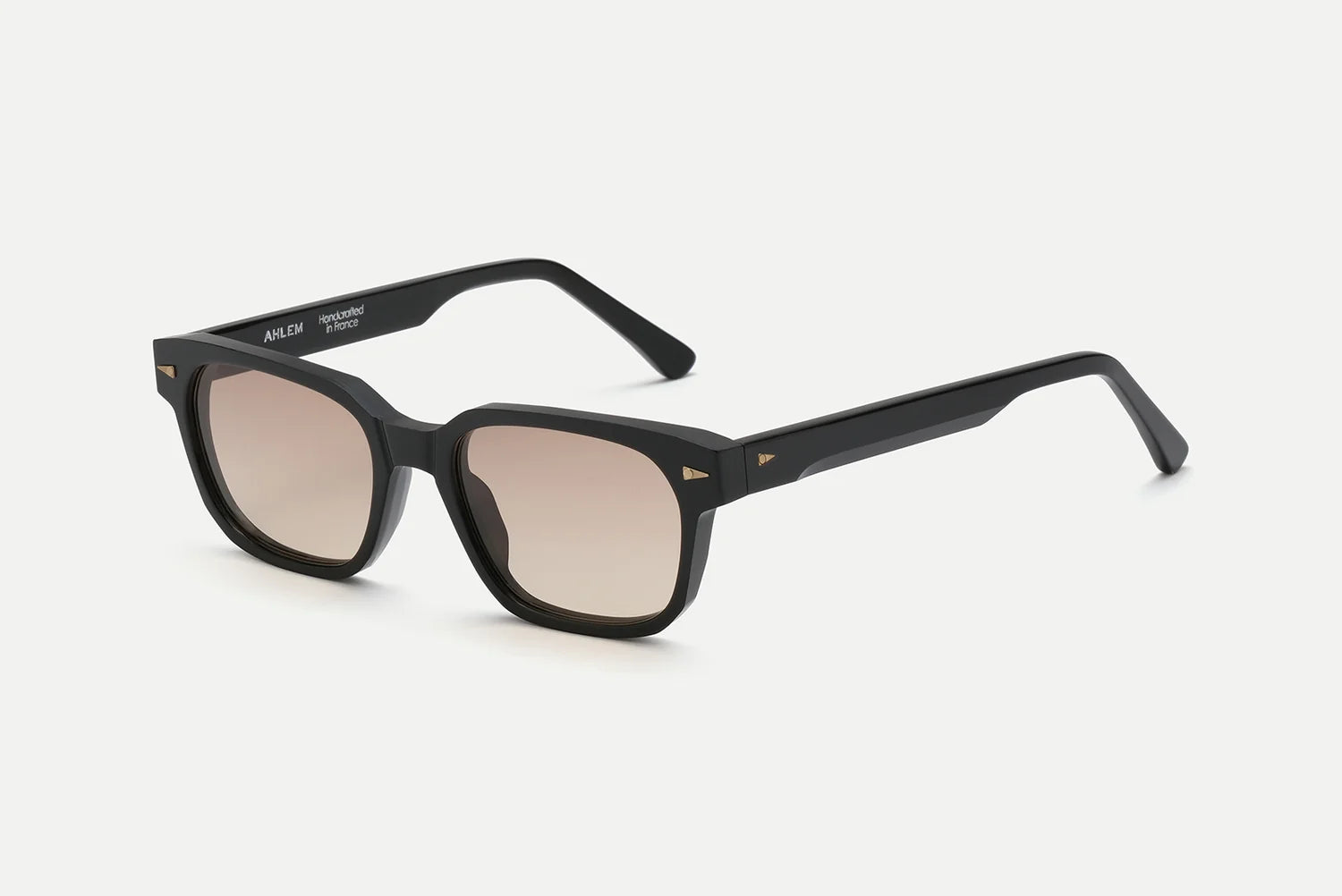 AHLEM Sedaine by AHLEM—handcrafted black rectangular acetate sunglasses featuring thick frames and light brown gradient lenses, showcased on a white background—exemplify the finest in luxury French eyewear.