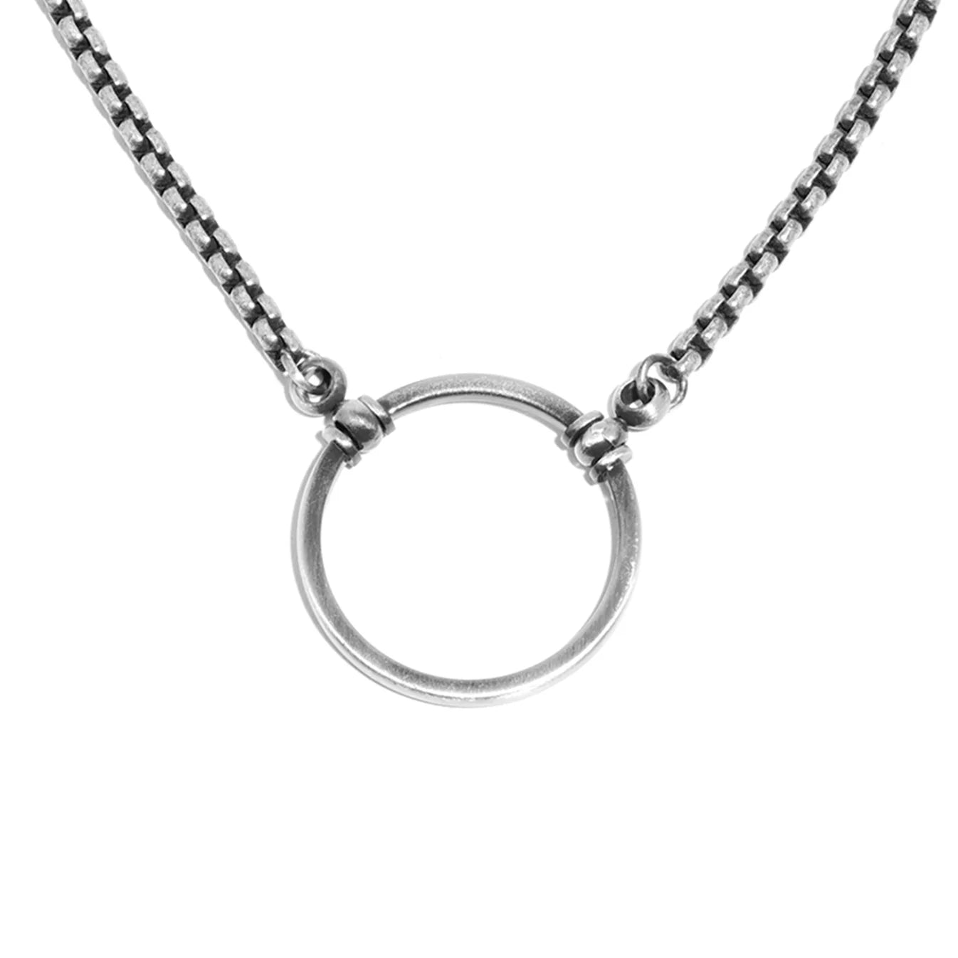 Silver necklace with a circular pendant on a white background