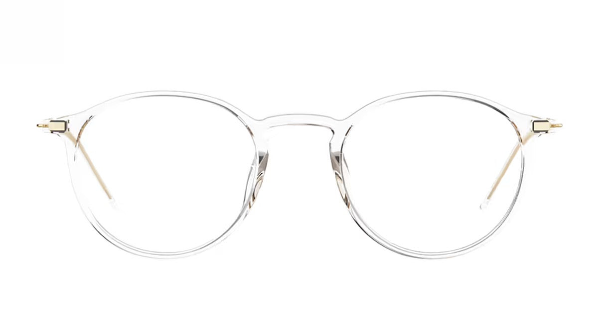 Clear, round eyeglass frames with thin metal arms and a screwless hinge, seen from the front on a white background—the lool Hangar 2 49 by LOOL exemplifies elegant, lightweight eyewear design from a Barcelona studio.