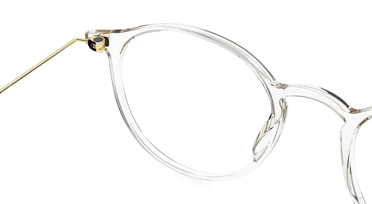 Close-up of the lool Hangar 2 49 eyeglasses by LOOL, featuring clear, round frames and thin gold temple arms with a screwless hinge, expertly crafted by a Barcelona design studio and isolated on a white background.