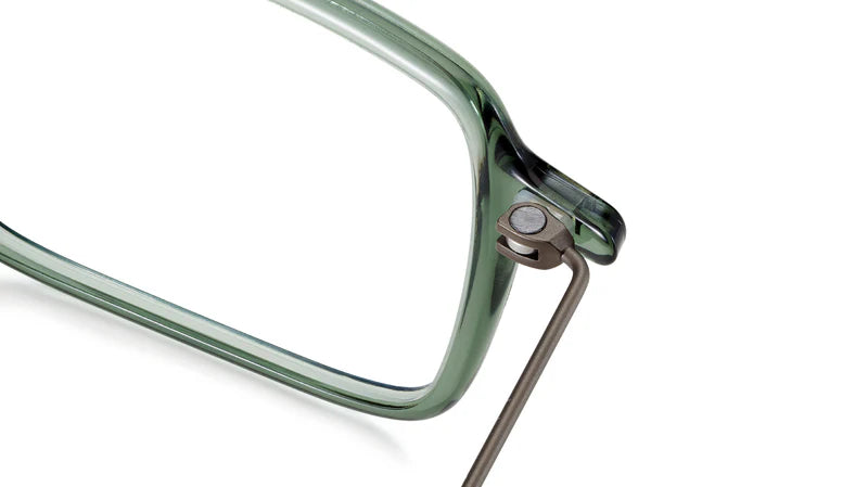 Close-up of a green eyeglasses frame on a white background