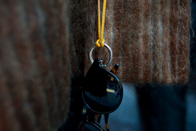 Keychain with a key attached to a textured surface