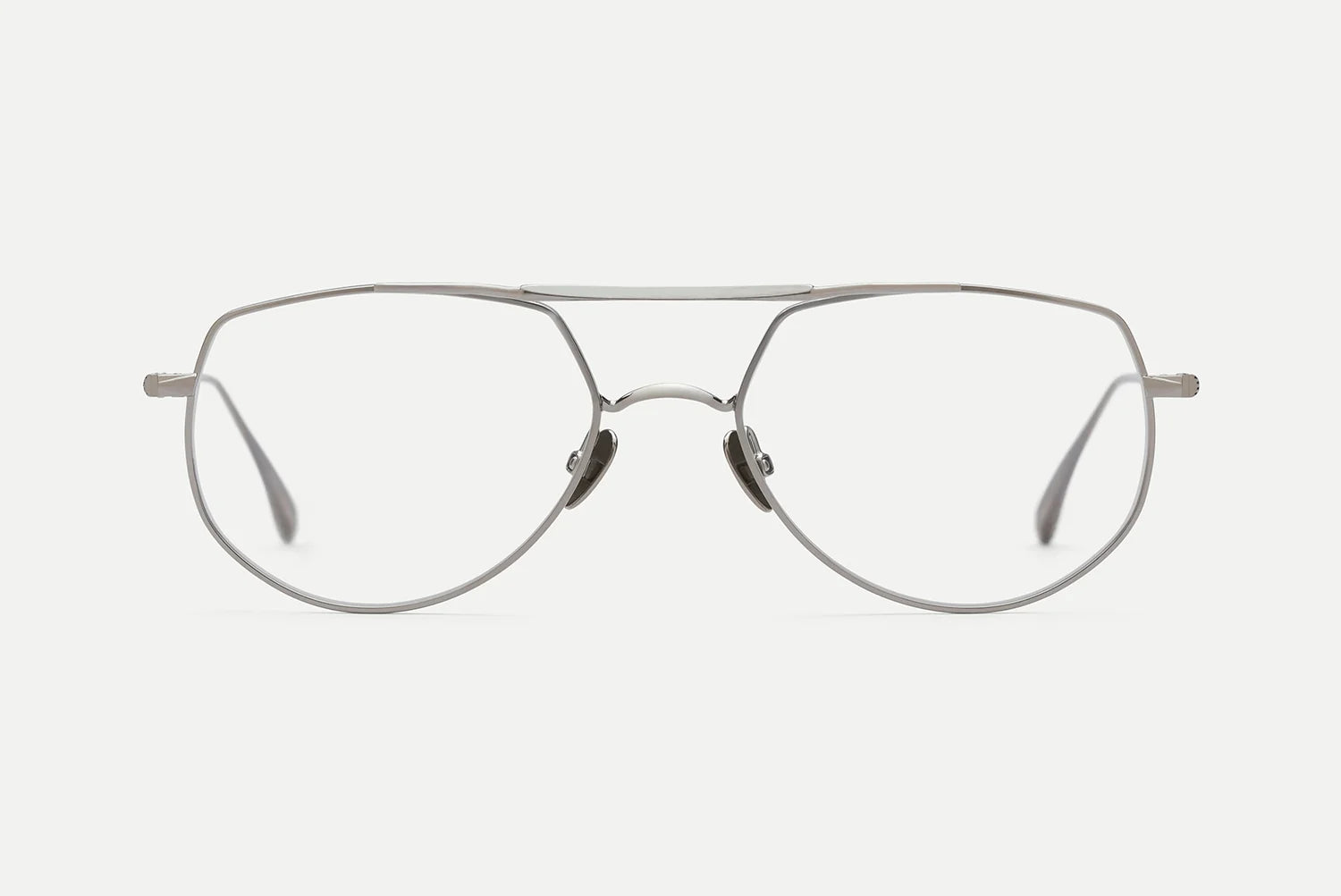 AHLEM Cadet by AHLEM – handcrafted silver metal aviator eyeglasses featuring clear lenses, adjustable nose pads, and thin frames, shown facing forward on a white background.