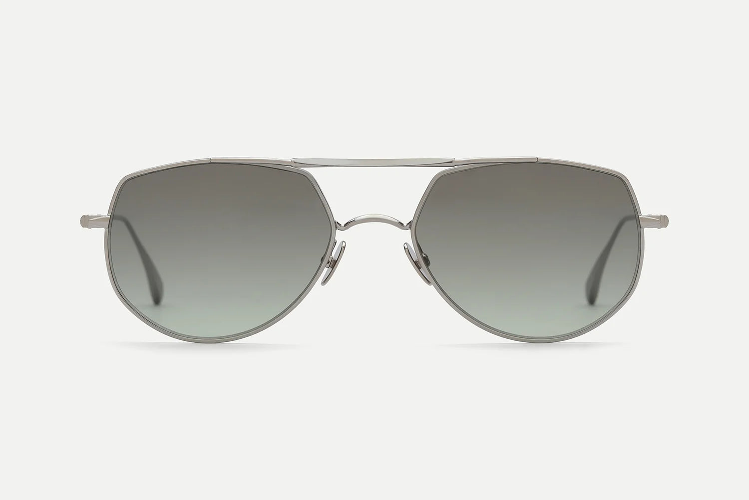 The AHLEM Cadet aviator-style sunglasses by AHLEM are handcrafted in France, featuring thin silver metal frames and dark gradient lenses, displayed against a plain white background.