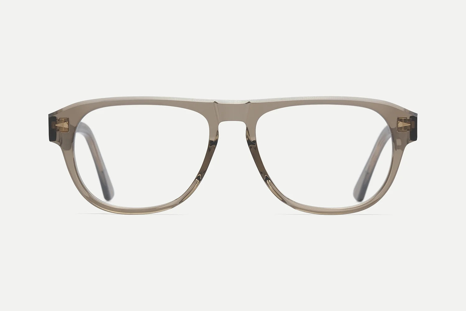 A pair of thick, translucent taupe-brown square eyeglass frames with gold metal hinges, shown against a plain light gray background.