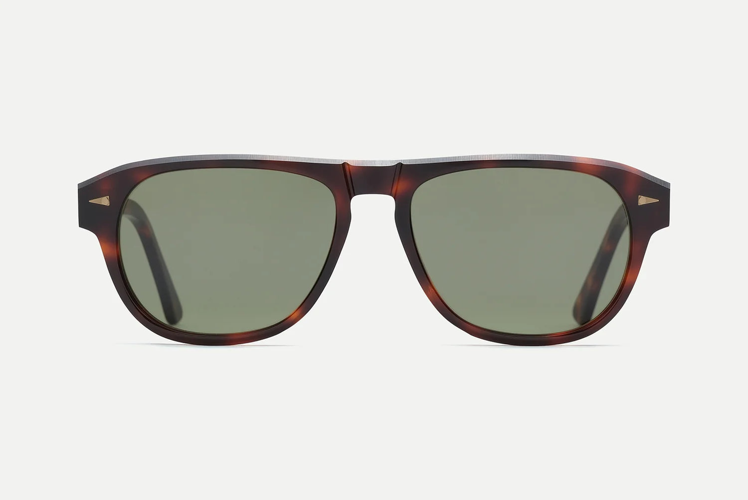 The AHLEM Carpentier sunglasses by AHLEM feature a pilot-shaped acetate frame in brown tortoiseshell and green tinted lenses, handcrafted in France and displayed from the front against a plain light background.