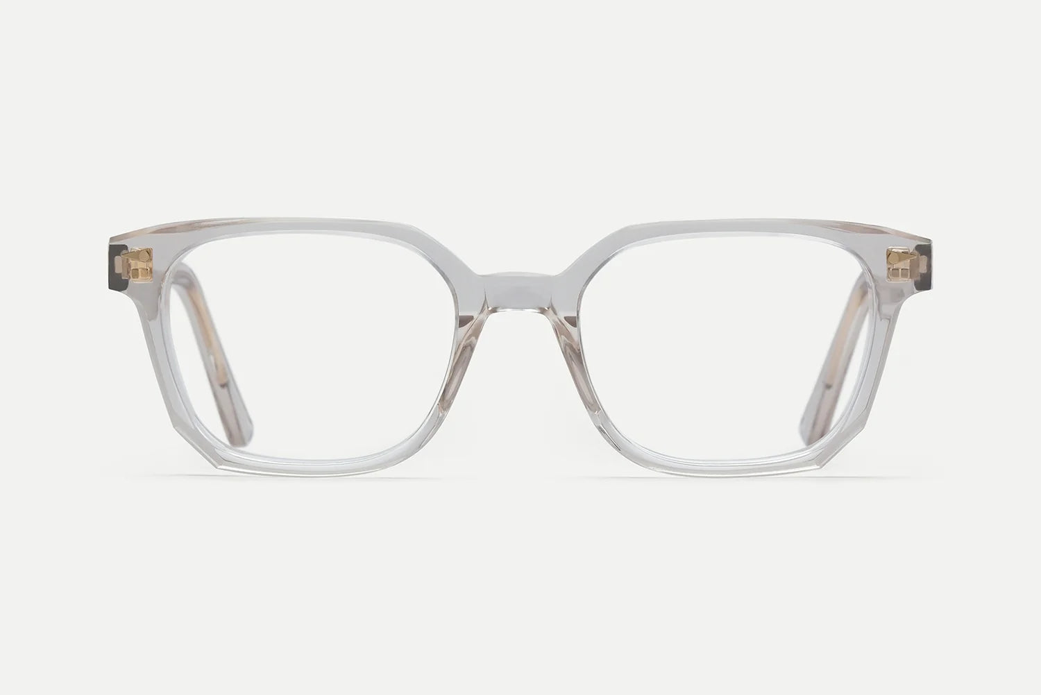 The AHLEM Houdon by AHLEM showcases clear, rectangular eyeglass frames with gently rounded edges, meticulously handcrafted from high-quality acetate and enhanced with premium steel hardware, displayed against a plain white background.