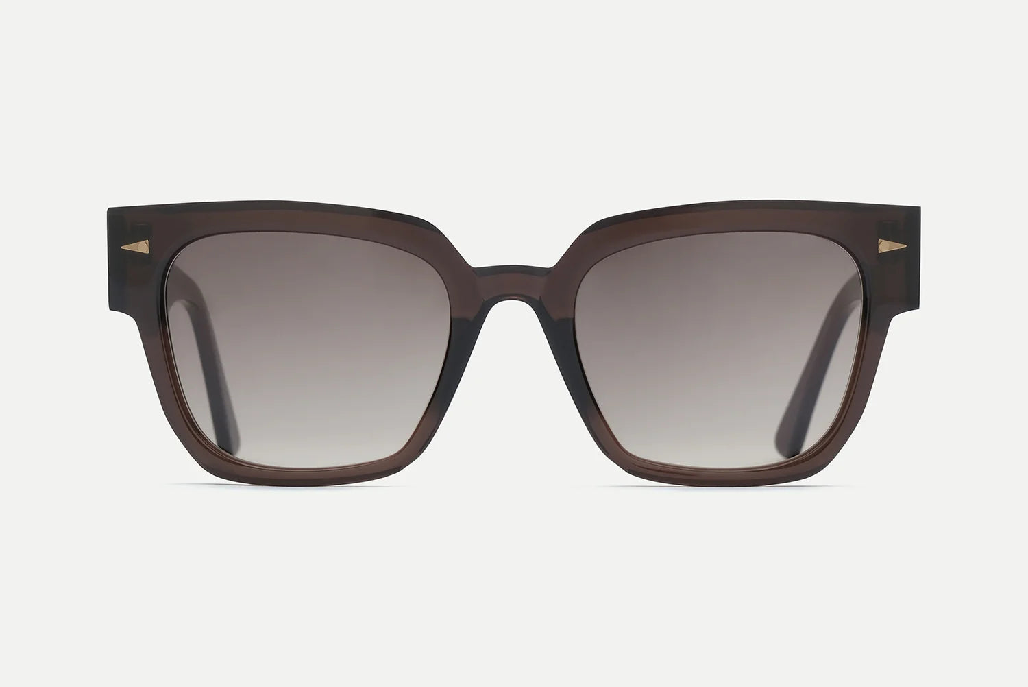 A pair of oversized square sunglasses with a translucent dark brown acetate frame and gradient gray lenses, featuring small gold metal accents on the temples.