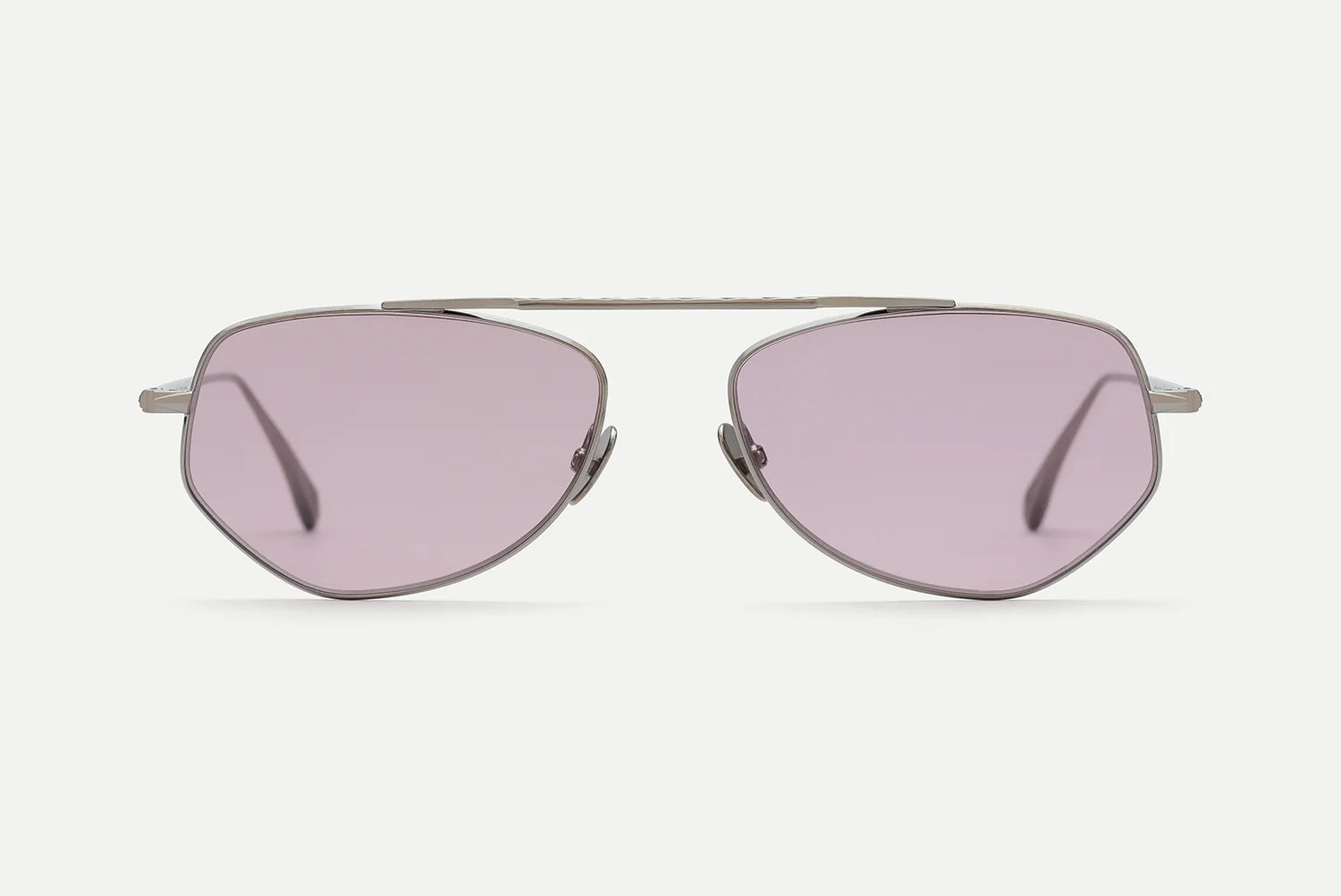 Front view of AHLEM Julien geometric metal aviator sunglasses by AHLEM, featuring light purple-tinted lenses and slim silver frames, handcrafted in France and set against a plain white background.