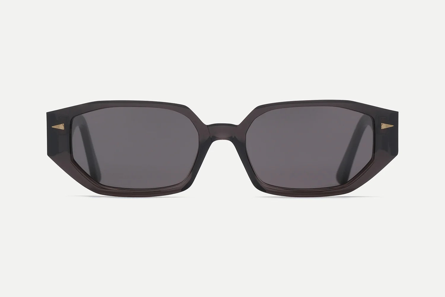 The AHLEM Poitou by AHLEM showcases angular, oversized black frames crafted from premium Italian acetate for a luxurious finish. Geometric edges are highlighted by small gold triangles near the hinges, reflecting meticulous French handcrafted quality. The sunglasses feature dark lenses and are presented against a plain white background.