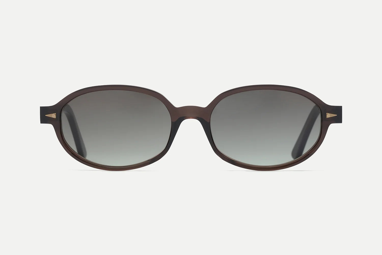 The AHLEM Rohan sunglasses by AHLEM are round, dark brown shades with thick black frames, handcrafted in France from premium Italian acetate and featuring gradient gray-tinted lenses. Shown on a white background facing directly forward.