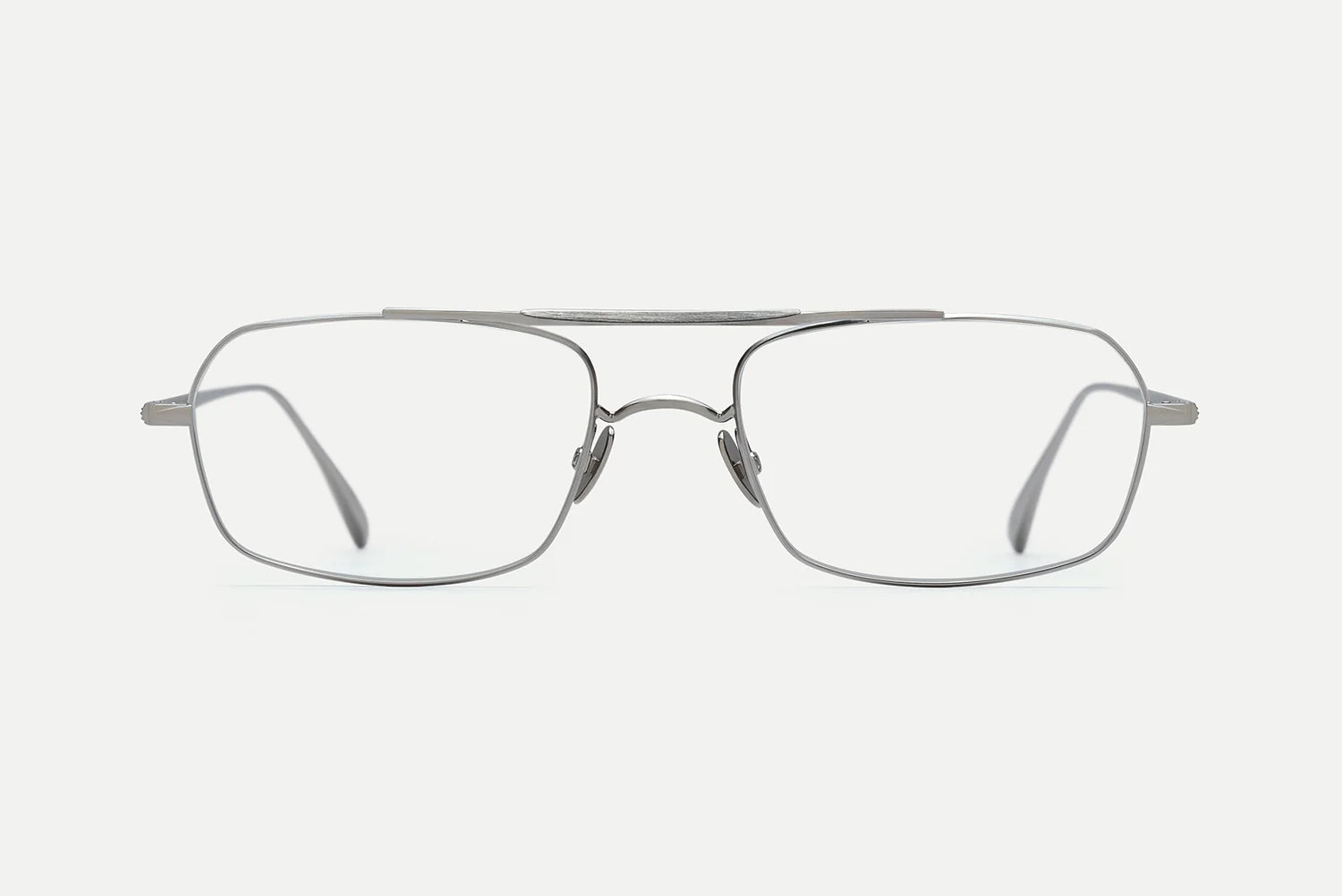 A pair of silver metal eyeglasses with a double bridge and rectangular lenses, shown from the front on a light gray background.