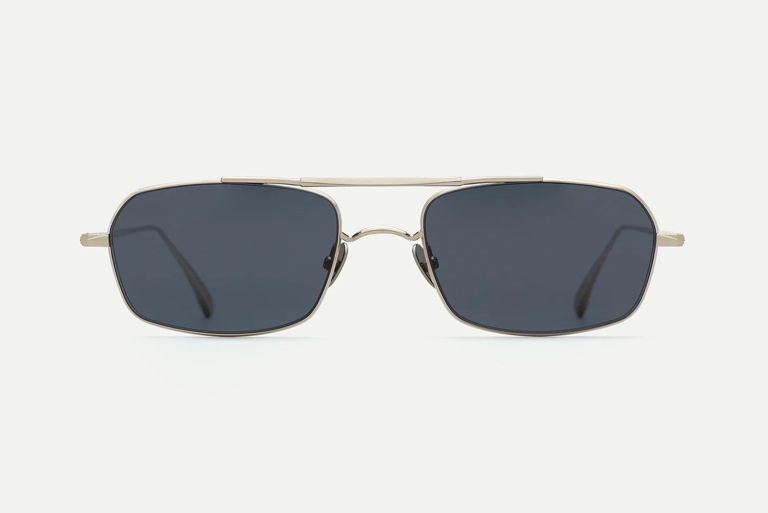 AHLEM Trevise sunglasses by AHLEM, featuring a rectangular aviator design with dark lenses and a thin silver metal frame, handcrafted in France and displayed against a plain white background.