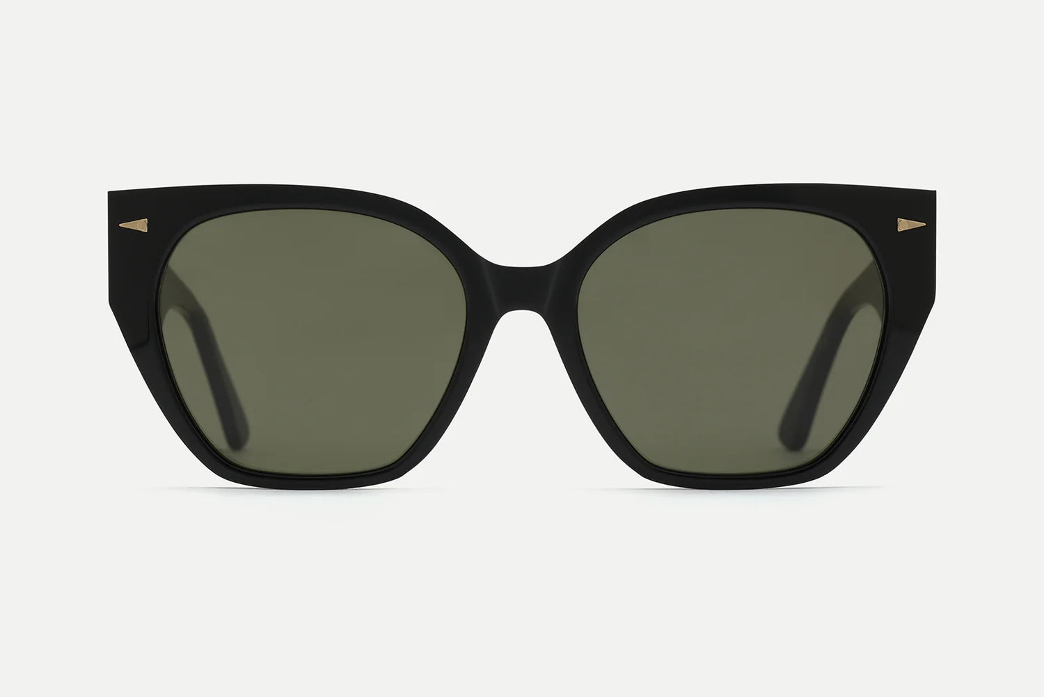 Black acetate sunglasses with an oversized rounded square shape, olive green tinted lenses, and small gold arrowhead accents at the frame corners, shown front-facing on a white background.