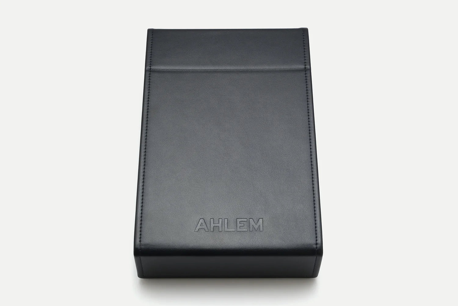 A rectangular black Nappa leather 4-unit travel case from the AHLEM Voyager Collection, featuring the AHLEM logo embossed on the front, photographed against a white background.