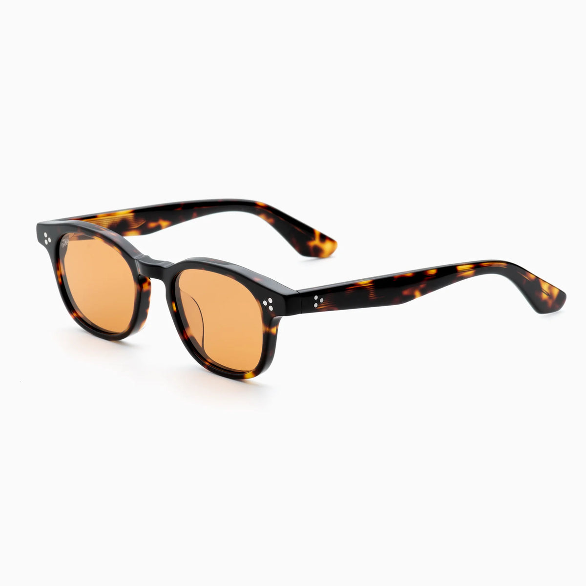 The Akila Atria sunglasses by Akila feature thick, tortoiseshell frames with round, orange-tinted lenses, offering a balanced silhouette and medium fit, displayed against a white background.