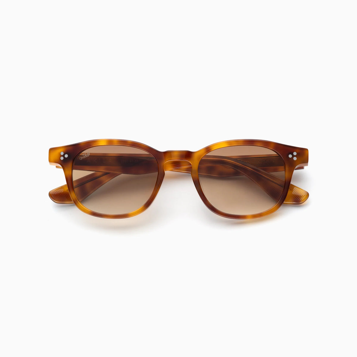 Akila Atria sunglasses by Akila, featuring a tortoiseshell round frame with brown lenses and a balanced, versatile silhouette, shown from the front against a white background.