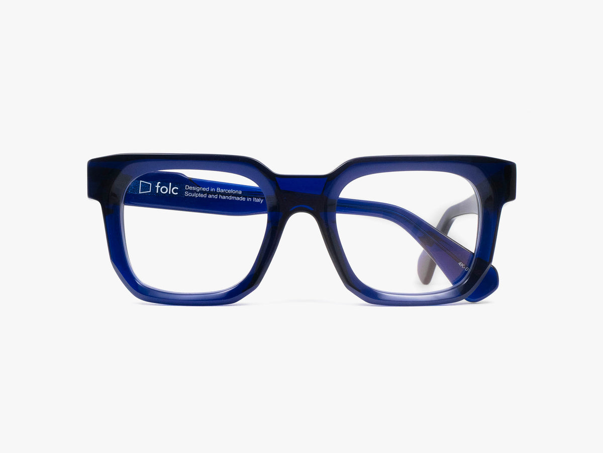 Folc Biel rectangular glasses featuring thick, translucent dark blue frames crafted from Italian-made acetate.