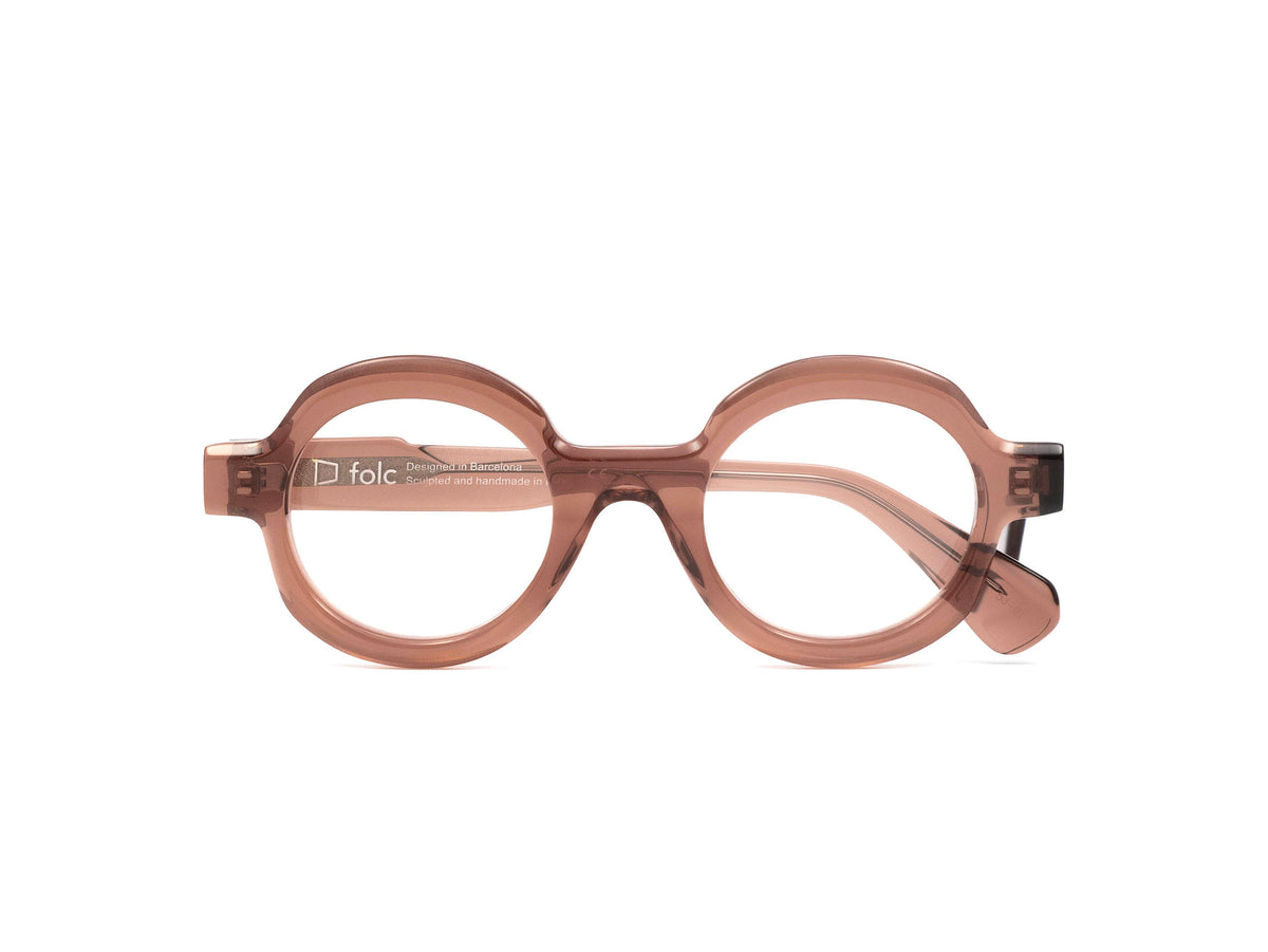 Folc Ciro round, translucent mauve-colored eyeglasses with a thick frame, crafted from Italian-made acetate.