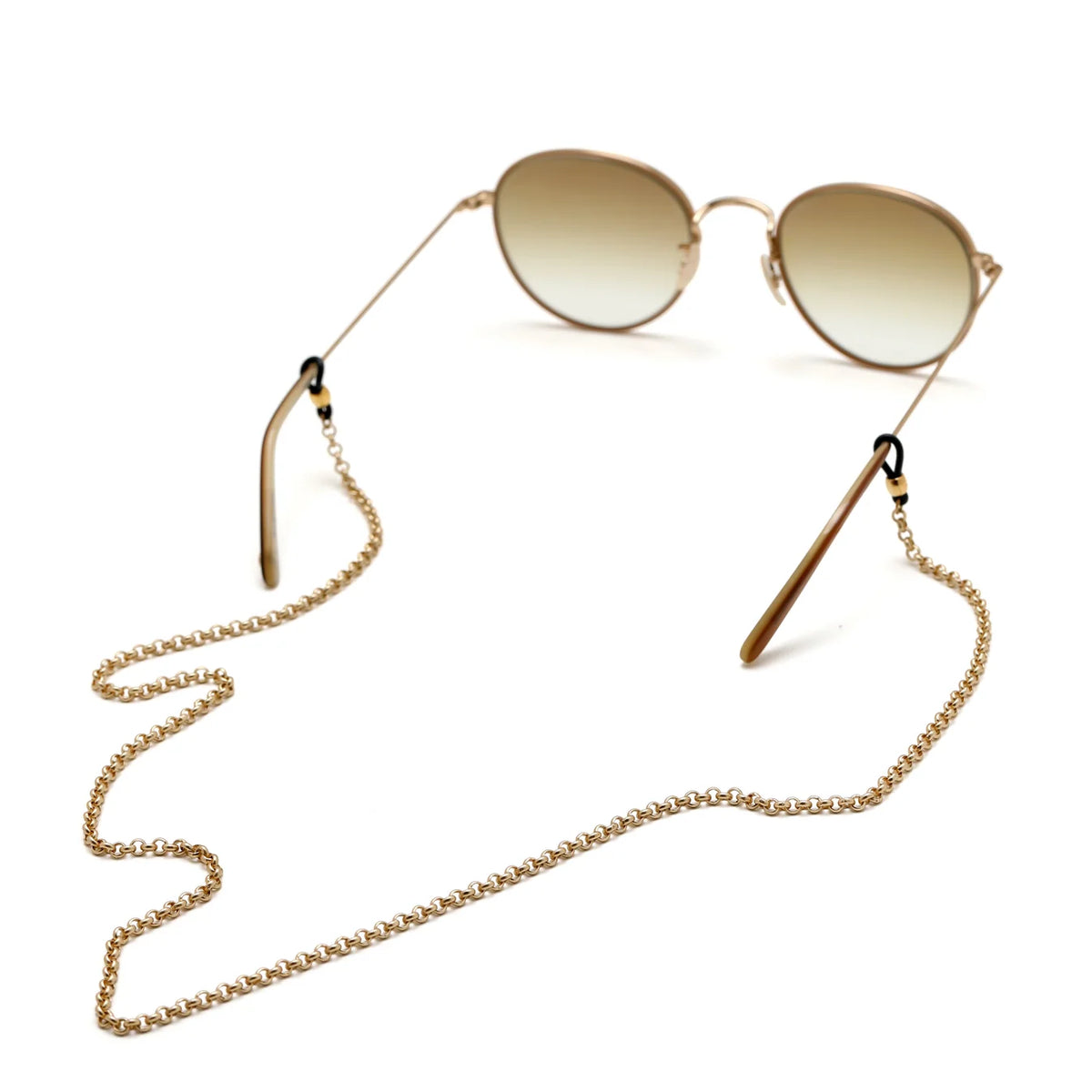 La Loop Claudia Leash, a gold-tone brass glasses leash, attached to round-framed sunglasses with gradient lenses.