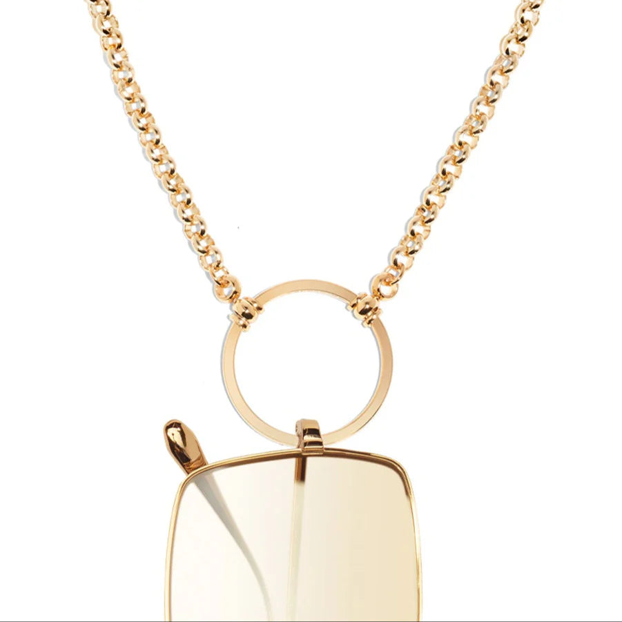 Gold necklace with a pendant on a white background