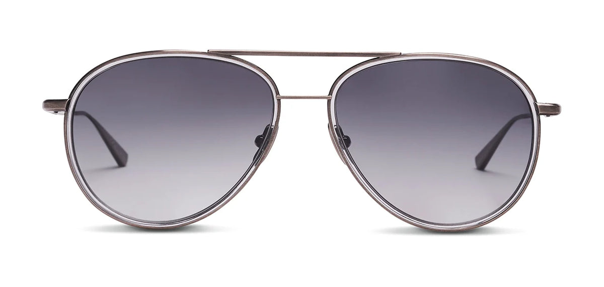 The SALT. Columbia 56 by SALT. is a pair of aviator sunglasses with dark, gradient lenses and thin metal frames featuring a subtle acetate insert, made in Japan, shown against a white background.