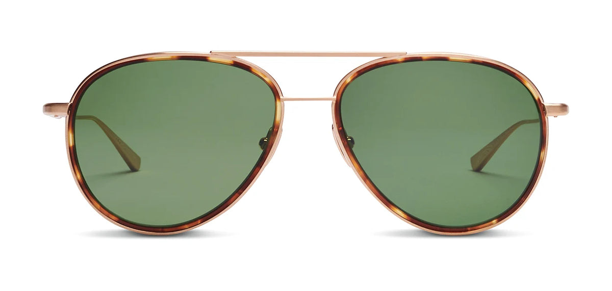 The SALT. Columbia 56 aviator sunglasses by SALT. showcase a thin gold frame with tortoiseshell accents, green tinted lenses, and a subtle acetate insert, expertly crafted in Japan and presented against a plain background.