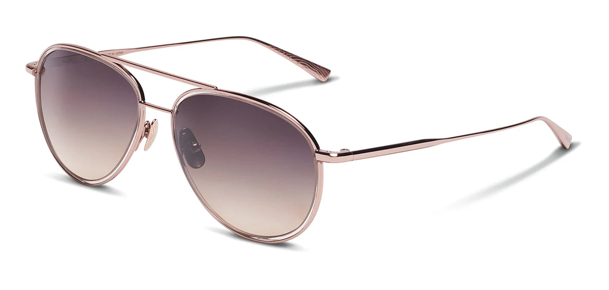The SALT. Columbia 56 by SALT. are rose gold metal aviator sunglasses featuring round lenses that gradient from dark at the top to light at the bottom and include an acetate insert, displayed against a white background.