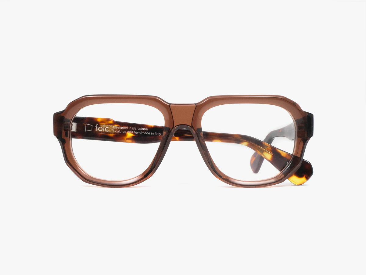 Folc Eris square eyeglasses in Italian-made acetate, featuring a thick, translucent tortoiseshell-patterned brown frame.
