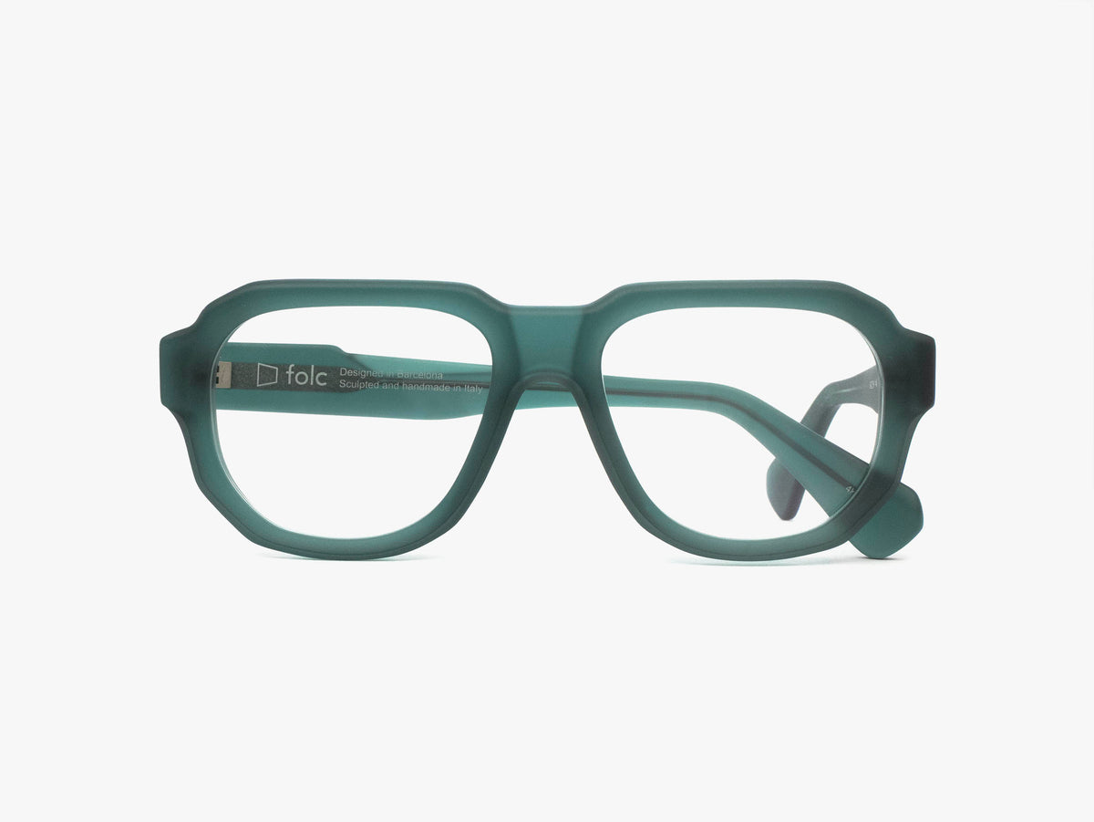 Folc Eris teal-colored Italian-made acetate eyeglasses with a thick, angular frame and clear lenses.
