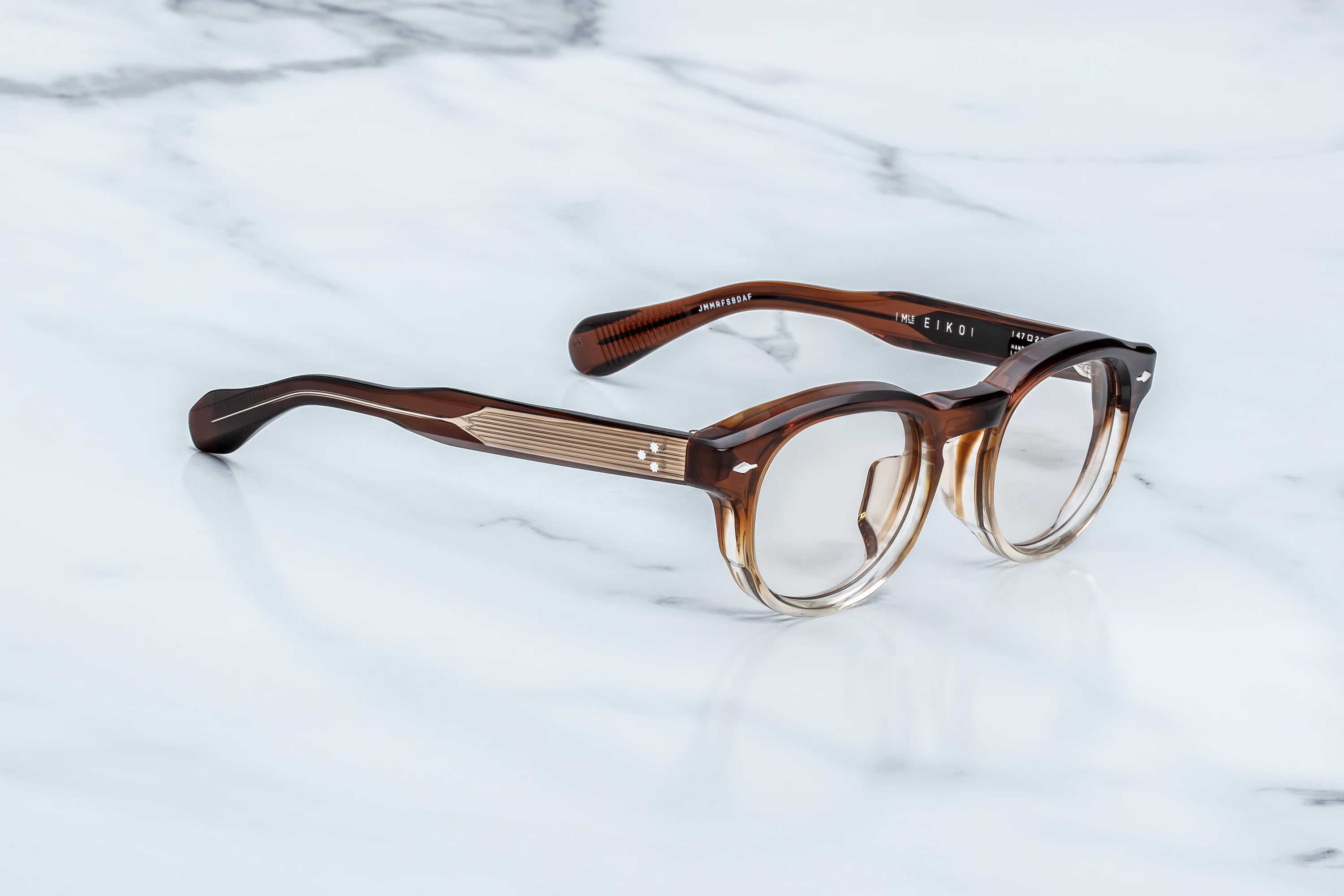 Brown eyeglasses on a marble surface