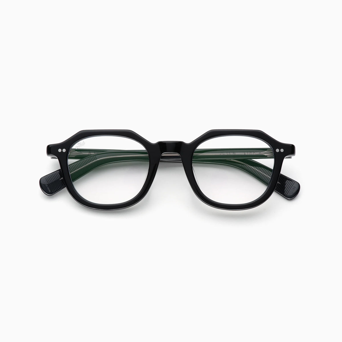 Akila Eira black round eyeglasses with thick frames and clear lenses, inspired by mid-century French crown panto style, are shown from the front on a plain white background. The arms of these Akila Optical frames are slightly open and visible through the lenses, which feature blue light blocking technology.