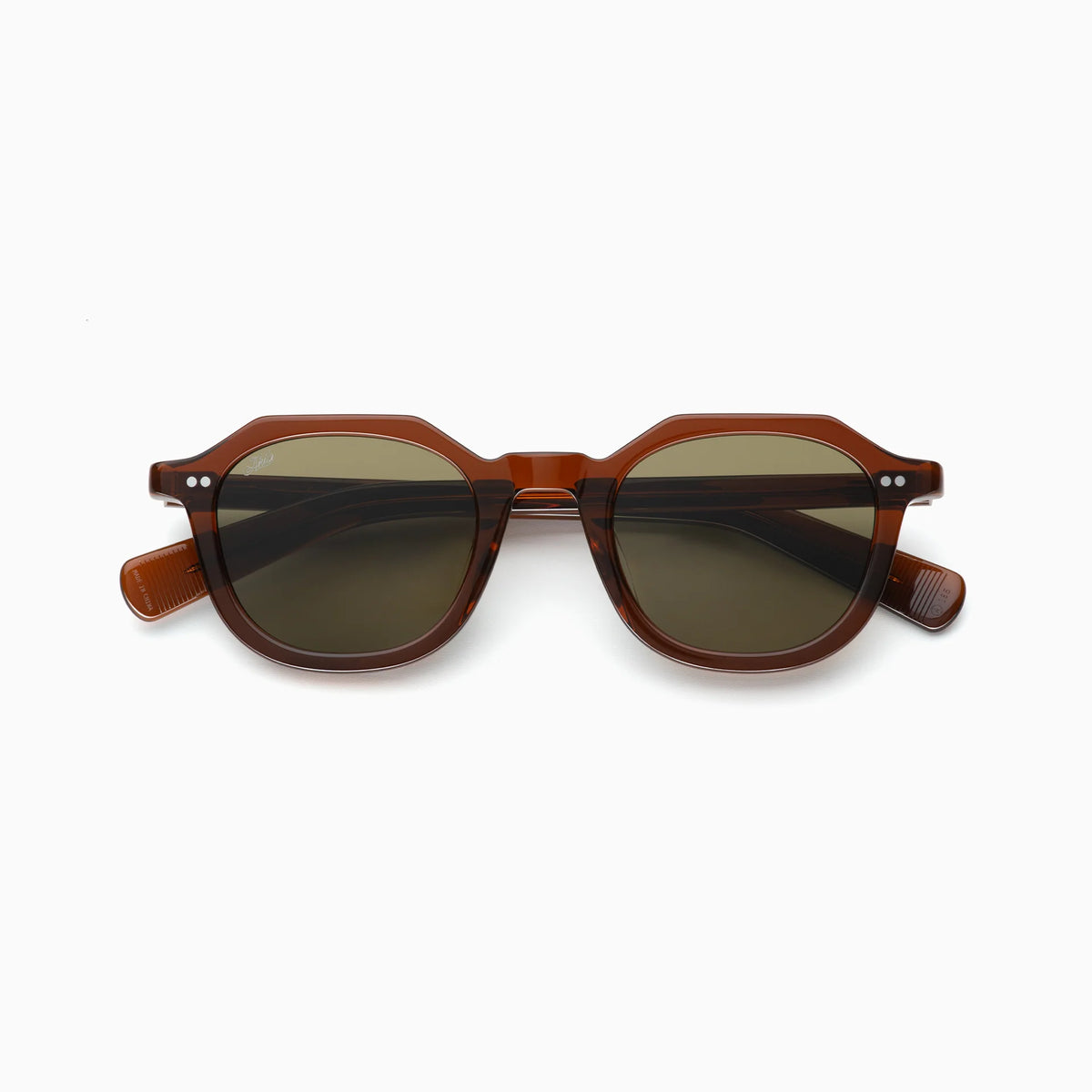 The Akila Eira by Akila is a pair of contemporary brown-framed sunglasses with dark lenses, displayed from the front against a white background. Featuring a geometric design with rounded edges and silver accents near the hinges, these glasses subtly reference mid-century French crown panto styles.
