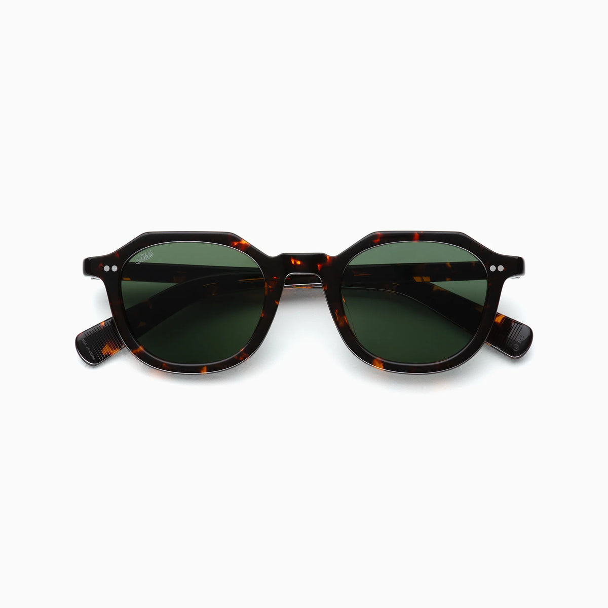 The Akila Eira sunglasses by Akila, featuring tortoiseshell frames and round green-tinted lenses inspired by the mid-century French crown panto style, are displayed against a white background.