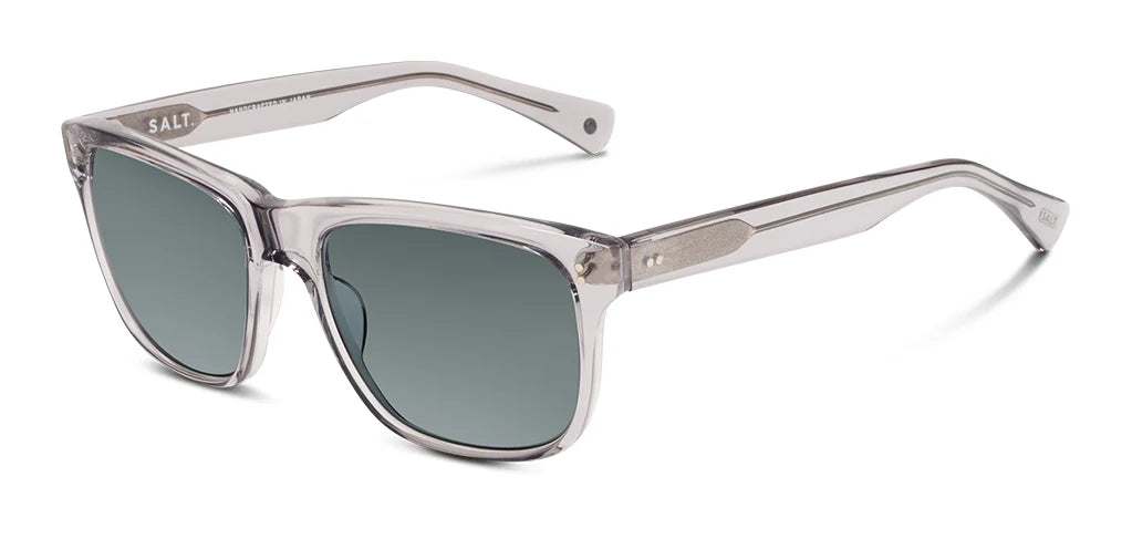 The SALT. Elihu sunglasses by SALT. feature a translucent gray rectangular design with thick Japanese acetate frames, green-tinted polarized optical lenses, and durable rivet hinges accented with metal details on the arms, all displayed on a white background.