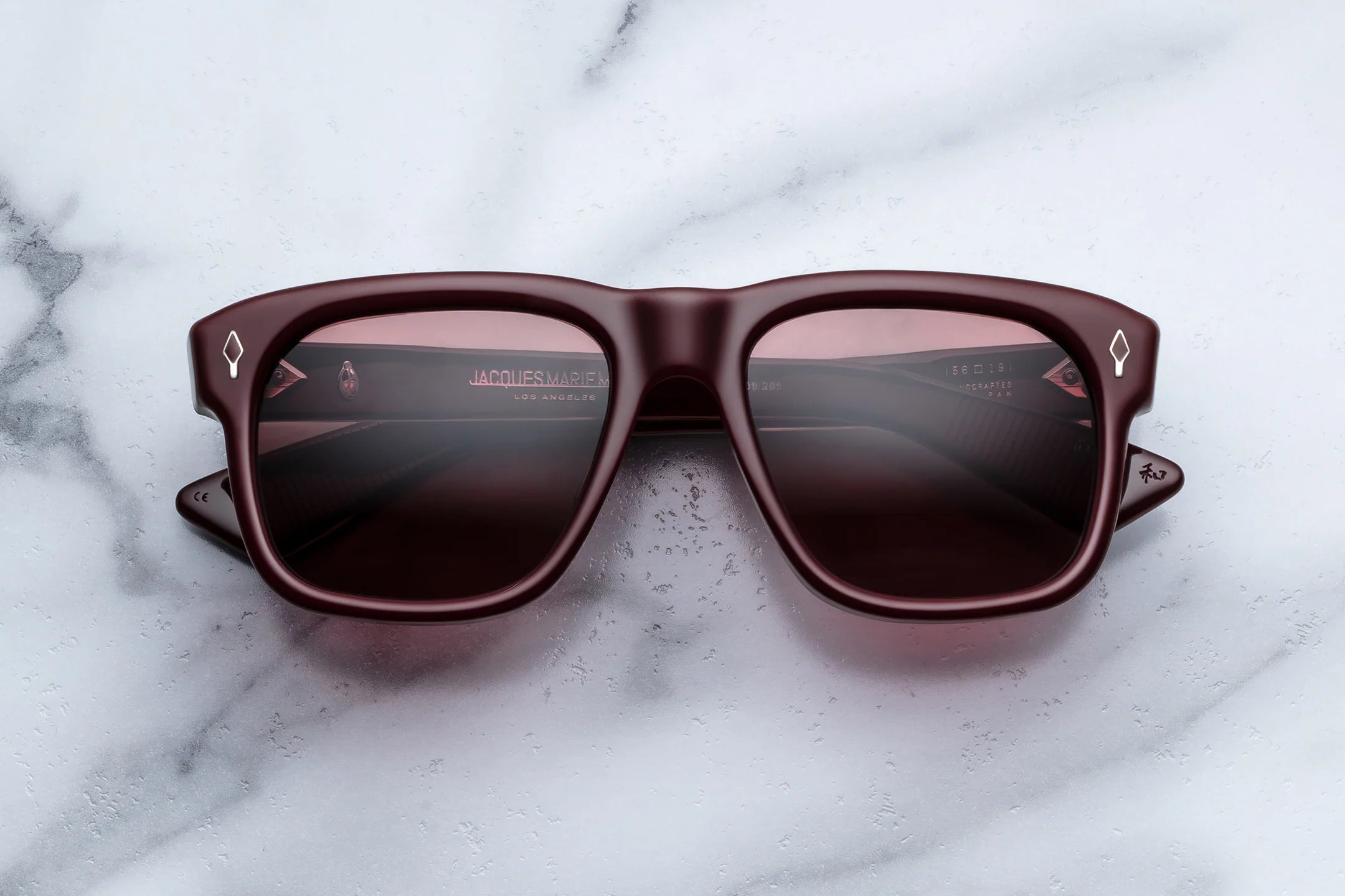 Oversized flat top Brown sunglasses on a marble surface