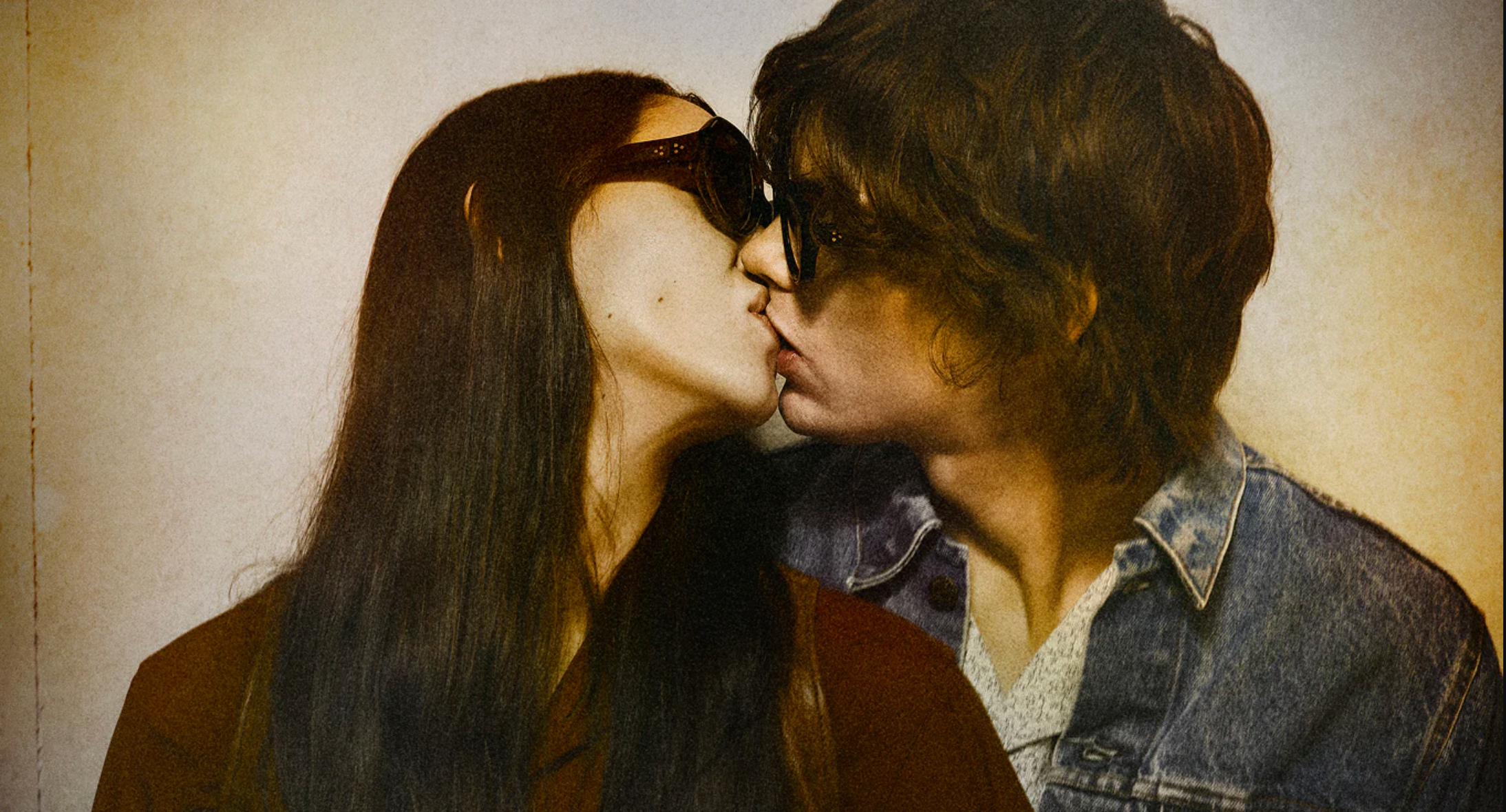 couple kissing wearing JMM and John Yoko 