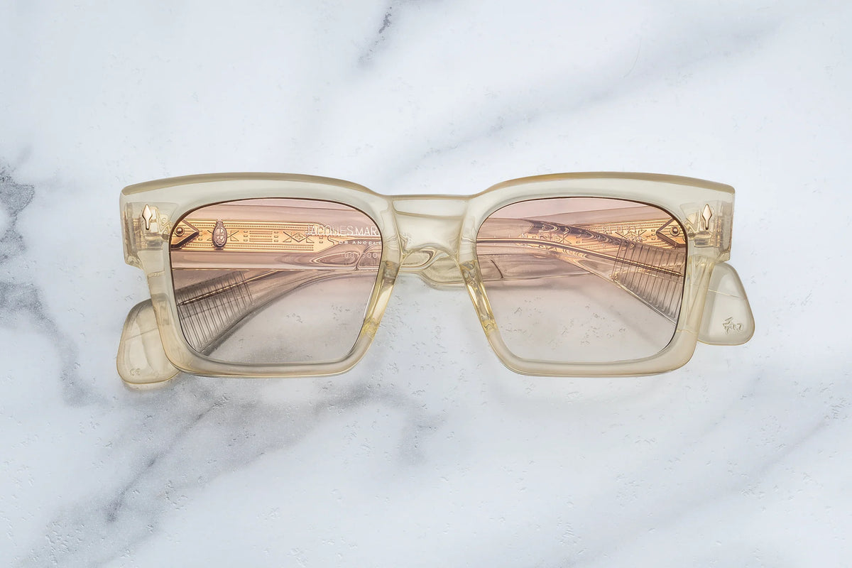 Jacques Marie Mage Kaine square-framed glasses with translucent beige frames and custom photochromic lenses.