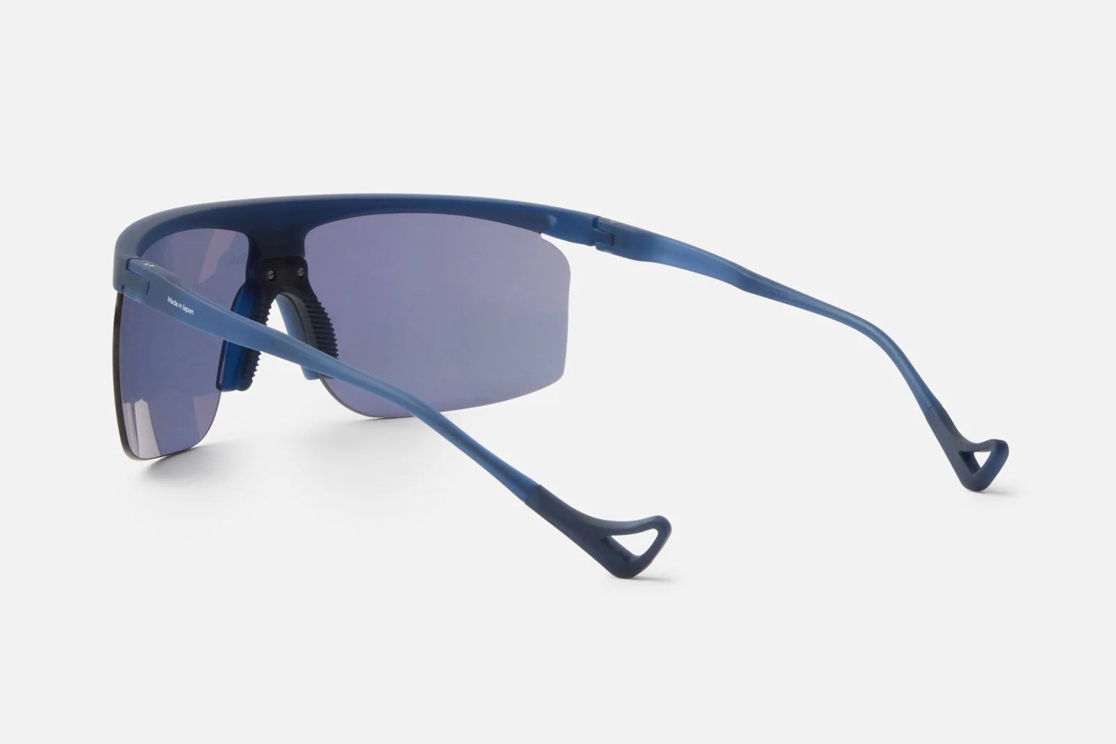 A pair of District Vision Konoha Sun Sprinter sports sunglasses in blue, featuring wraparound mirrored rectangular blade lenses and curved arms, displayed from the back on a plain light background. Equipped with advanced D+ lens technology from District Vision, these sunglasses offer outstanding clarity and protection for an active lifestyle.