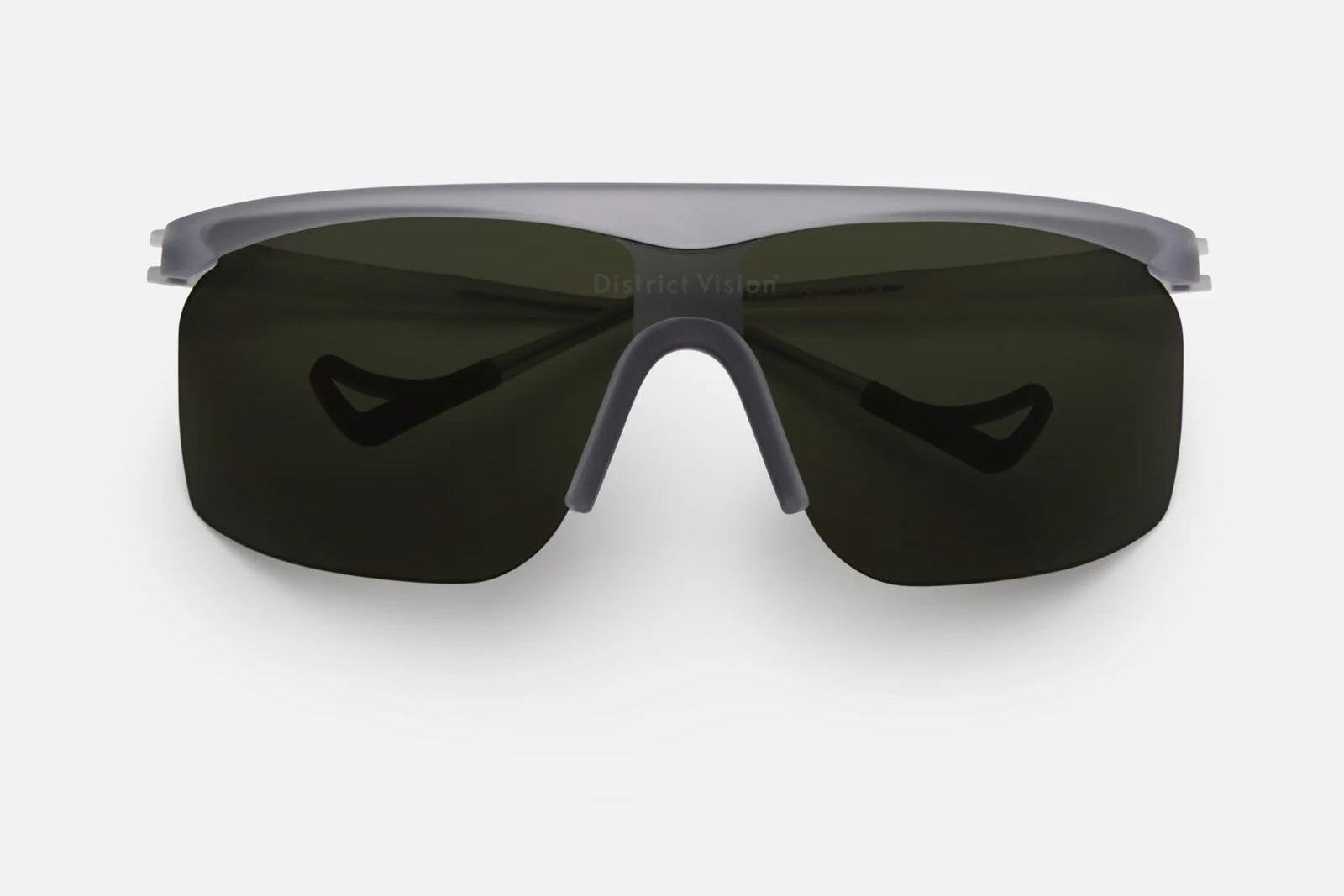 District Vision Konoha Sun Sprinter sports sunglasses by District Vision, featuring a sleek black single curved rectangular blade lens with advanced D+ lens technology and a matte gray frame, shown from the front on a plain white background.
