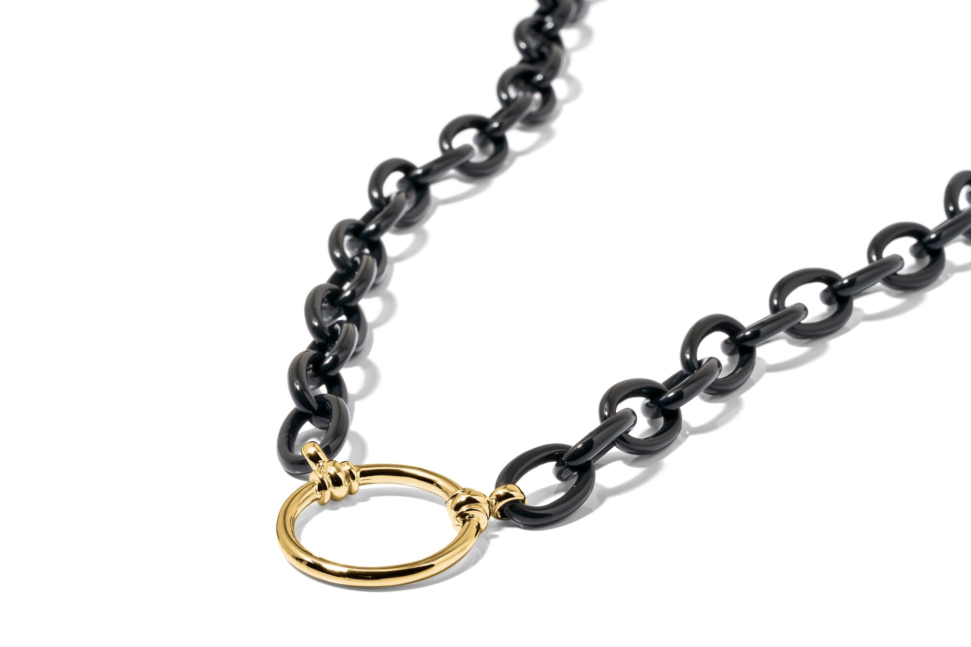 Black chain necklace with a gold clasp on a white background