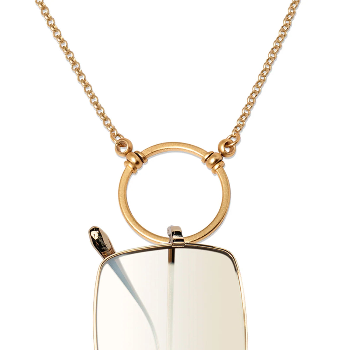 Gold-tone La Loop Claudia chain necklace featuring a circular pendant that holds the bridge of rectangular eyeglasses.