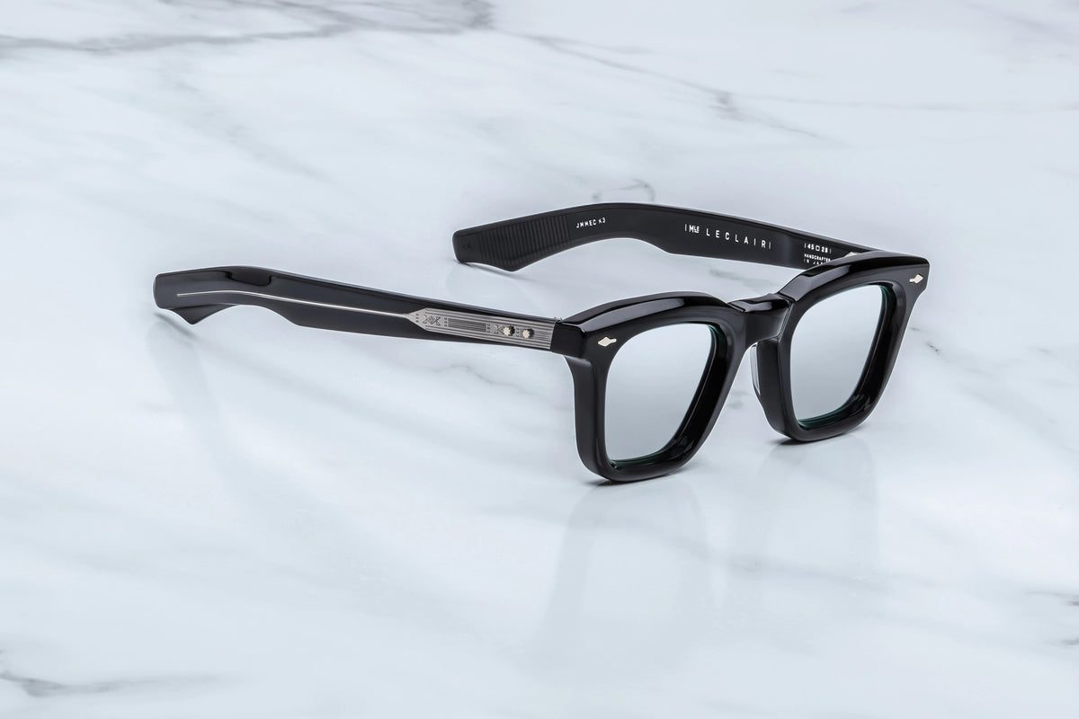 Jacques Marie Mage Leclair black rectangular glasses with a 50s-inspired Wellington silhouette, silver mirrored lenses, and engraved metal temples.