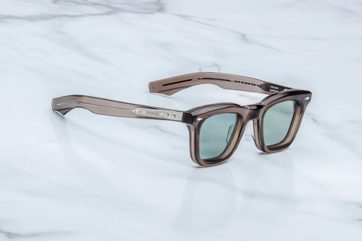 Jacques Marie Mage Leclair sunglasses in translucent brown-grey acetate with a 50s-inspired rectangular Wellington silhouette and light green tinted lenses.