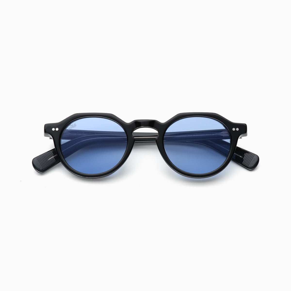 Akila Lola sunglasses by Akila feature a round, matte black contemporary frame with blue-tinted lenses and distinctive paddle-shaped temples, displayed against a plain white background.
